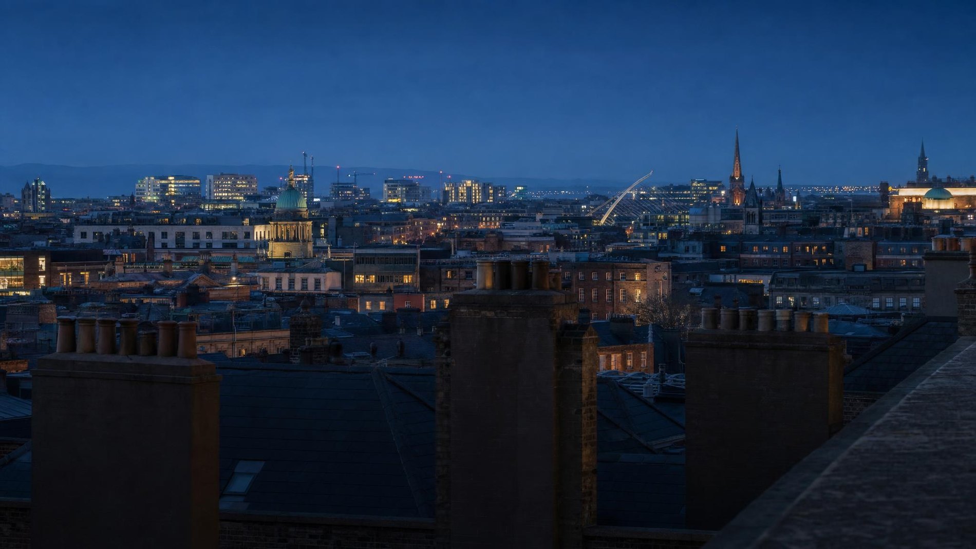Dublin rooftops and spires at blue hour